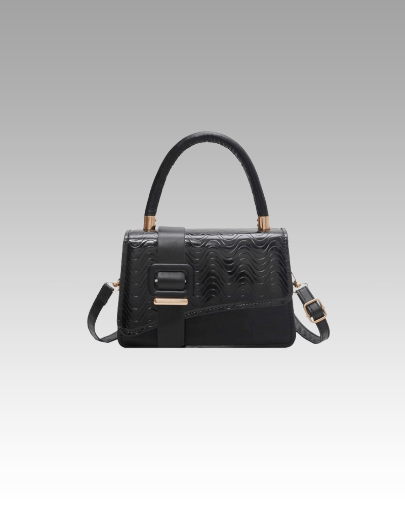 Le sac à main Gloria noir, symbole de sophistication, exposé avec classe dans la boutique Izamel.