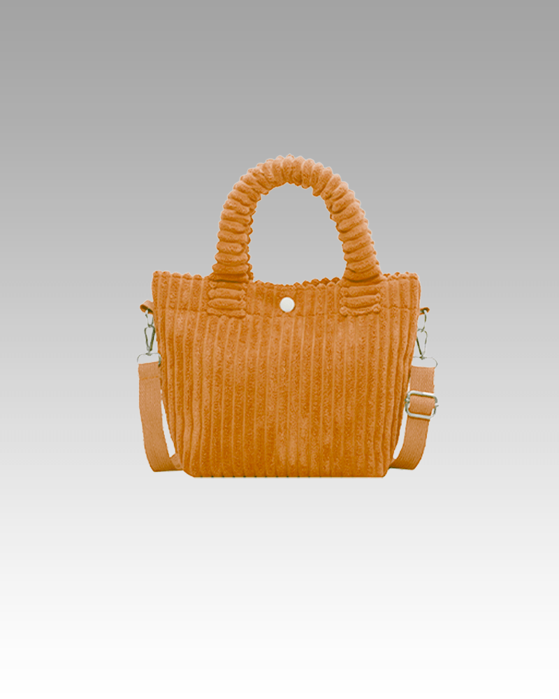 Explorez le Sac à Main Daisy en Velours Côtelé Orange chez Izamel, un accessoire mode qui incarne la vitalité et l'audace, ajoutant une touche vibrante à votre style.