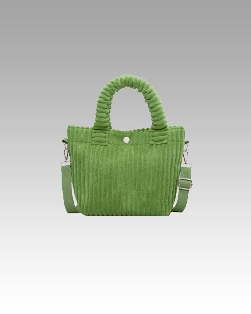 Découvrez le Daisy Sac à Main Fourre-Tout en Velours Côtelé Vert chez Izamel, un accessoire de mode qui allie sophistication et couleur vibrante, créant un look élégant pour les femmes modernes.