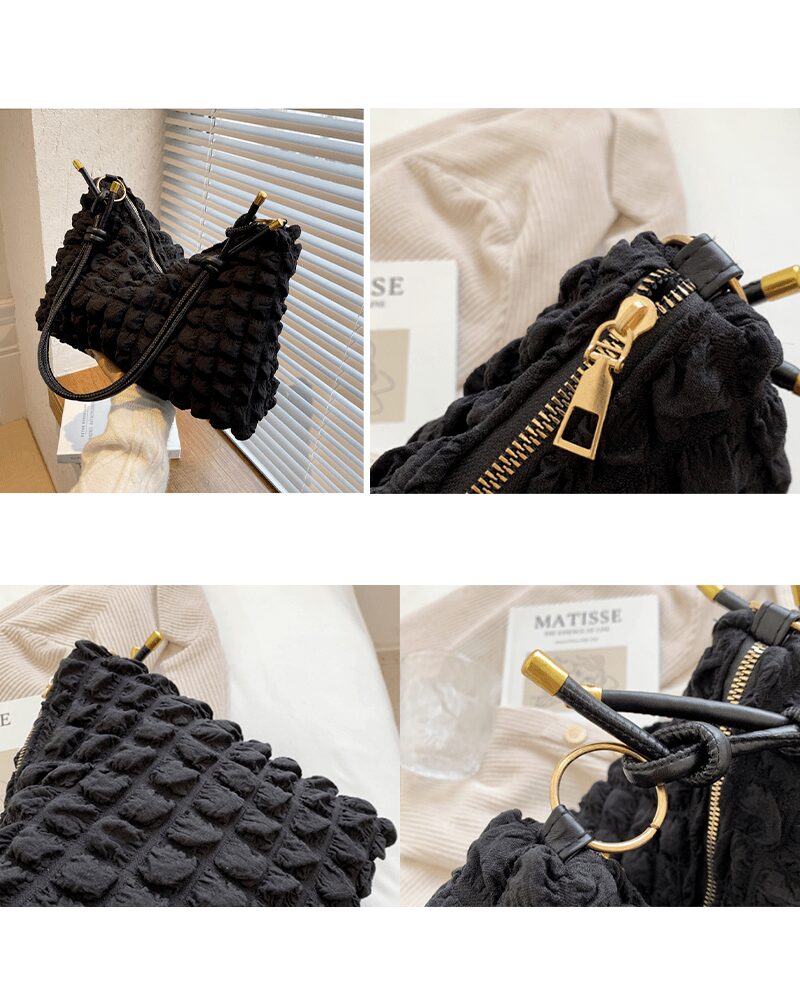 Découvrez le sac à main fourre-tout noir Kate, une pièce raffinée vue sous plusieurs perspectives.