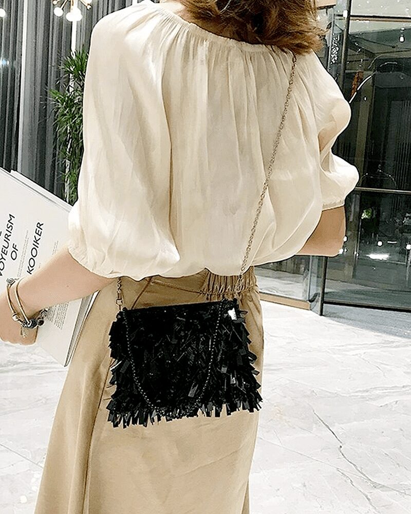 Sac à bandoulière noir pailleté Mandy, accessoire chic pour femme porté avec style en bandoulière.