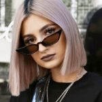 Lunettes de soleil Valentina motif léopard au style rétro, offrant une protection UV400, portées par une femme.