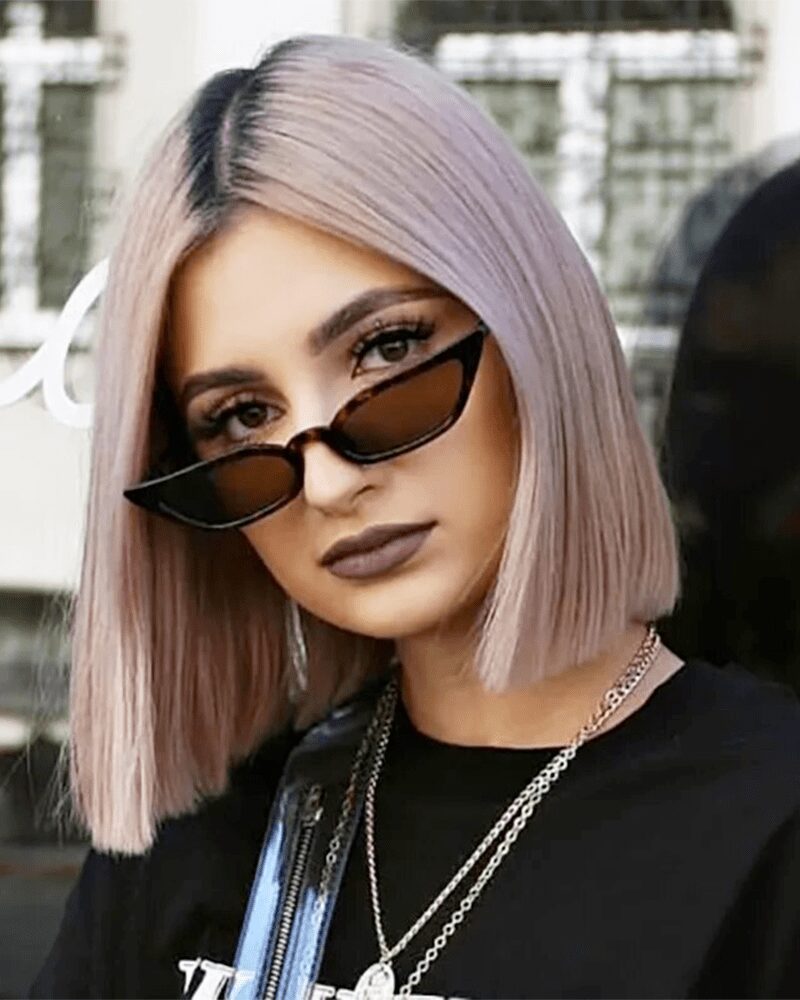 Lunettes de soleil Valentina motif léopard au style rétro, offrant une protection UV400, portées par une femme.